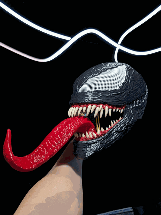 Venom mask helmet with movable jaw fits heads up to 24 inches with white or beige teeth
