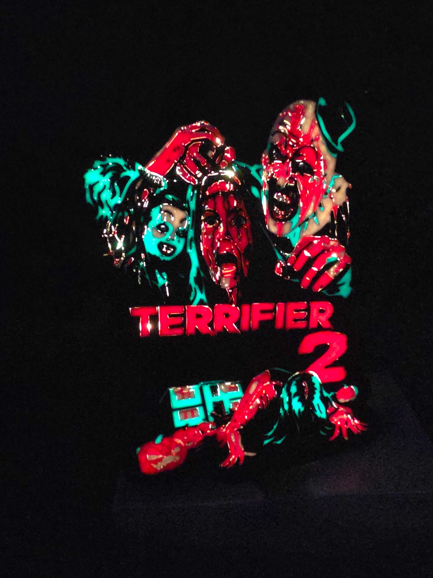 Terrifier 2 art of the clown in red, blue, white, and black lightbox