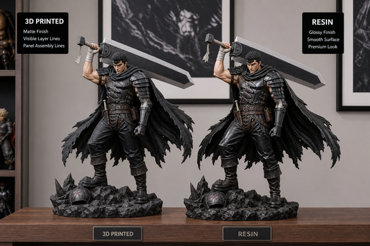 Two collector statues displayed side by side, one with a 3D printed matte finish and one with a smoother resin finish.