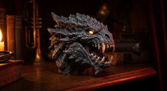 A dramatically lit, hyper-detailed 3D printed monster bust with textured scales and glowing eyes displayed on a dark wooden shelf in a collector's den.