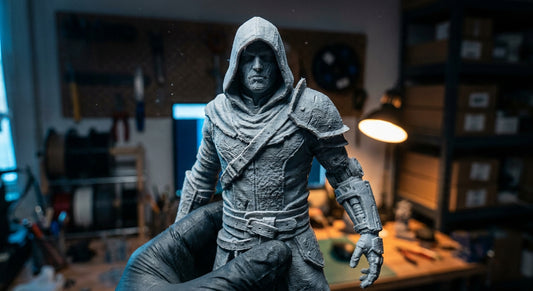 A dramatic, moody studio shot of a detailed life-size 3D printed collectible figure illuminated by atmospheric blue and amber lighting against a dark background.