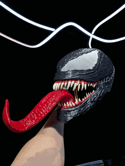 Venom mask helmet with movable jaw fits heads up to 24 inches with white or beige teeth