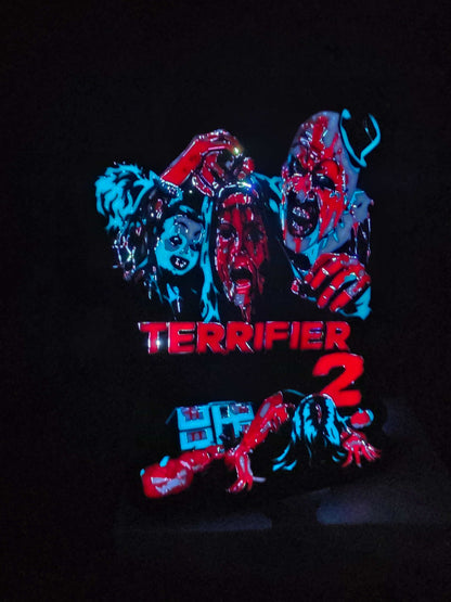 Terrifier 2 clown art lightbox with red blue white and black colors