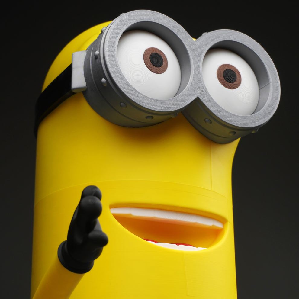 24-inch Kenny from Despicable Me Minions figure standing tall on display shelf