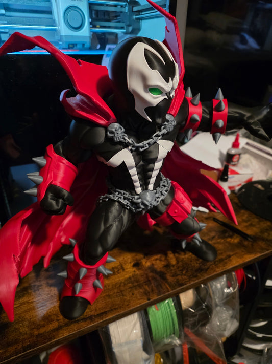 16-inch Spawn collectible figure with customizable grey or neon green chains and detachable cape pieces for display and collection