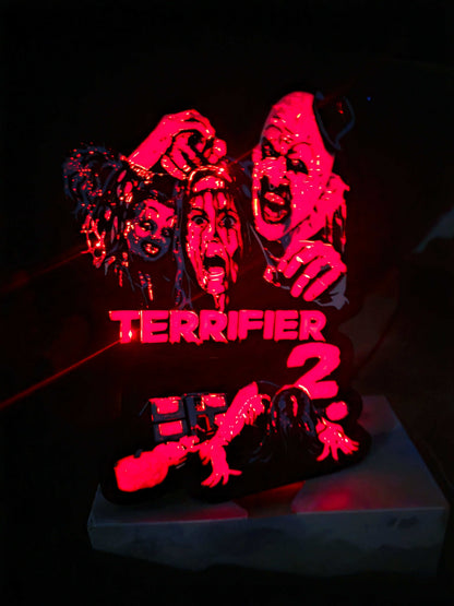 Terrifier 2 art clown lightbox with red blue white and black colors