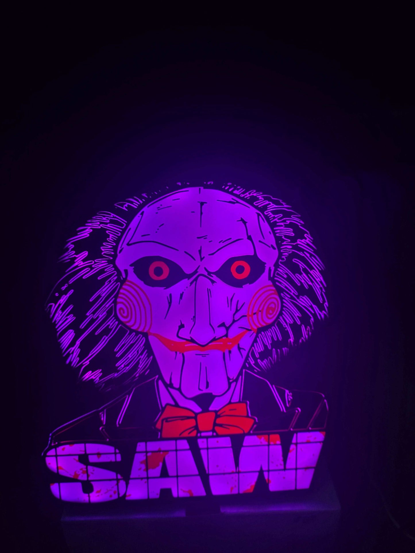 Large saw lightbox featuring ONN LED Billy the Puppet horror theme