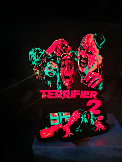 Terrifier 2 art clown lightbox with red blue white and black colors