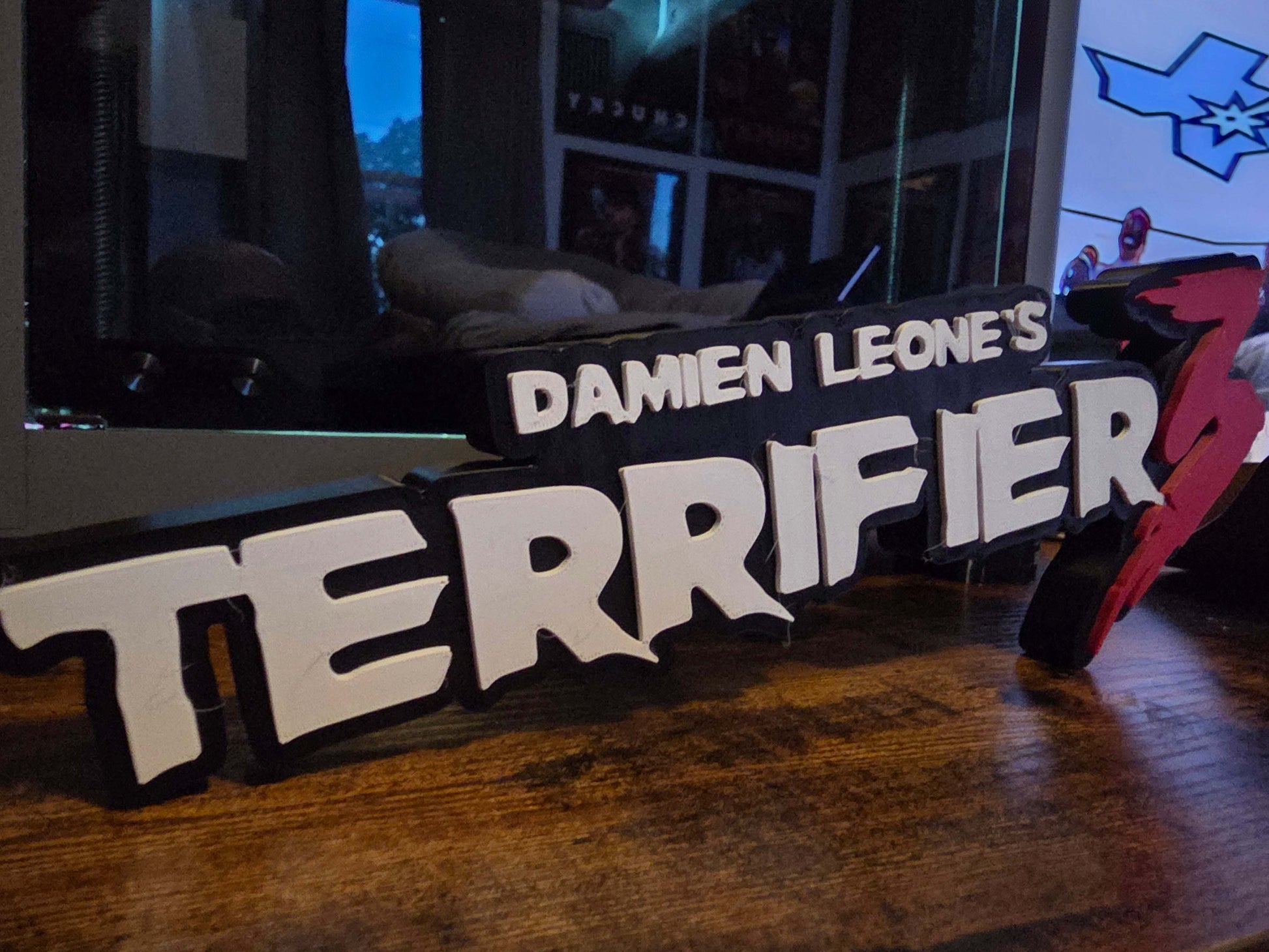 12-inch Terrifier logo art featuring Art the Clown horror prop for Halloween decor