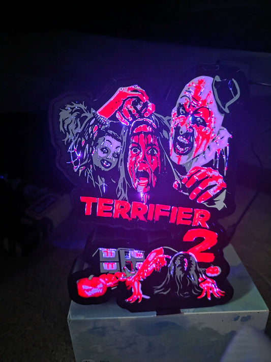 Terrifier 2 art lightbox featuring The Clown in red, white, grey, and black colors