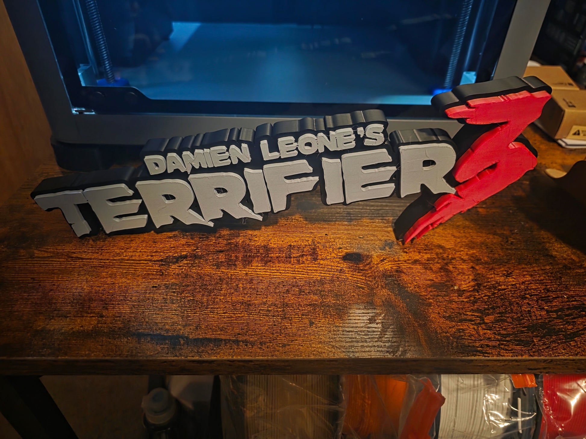 12-inch grey Terrifier 3 logo sign featuring The Clown motif for horror decor