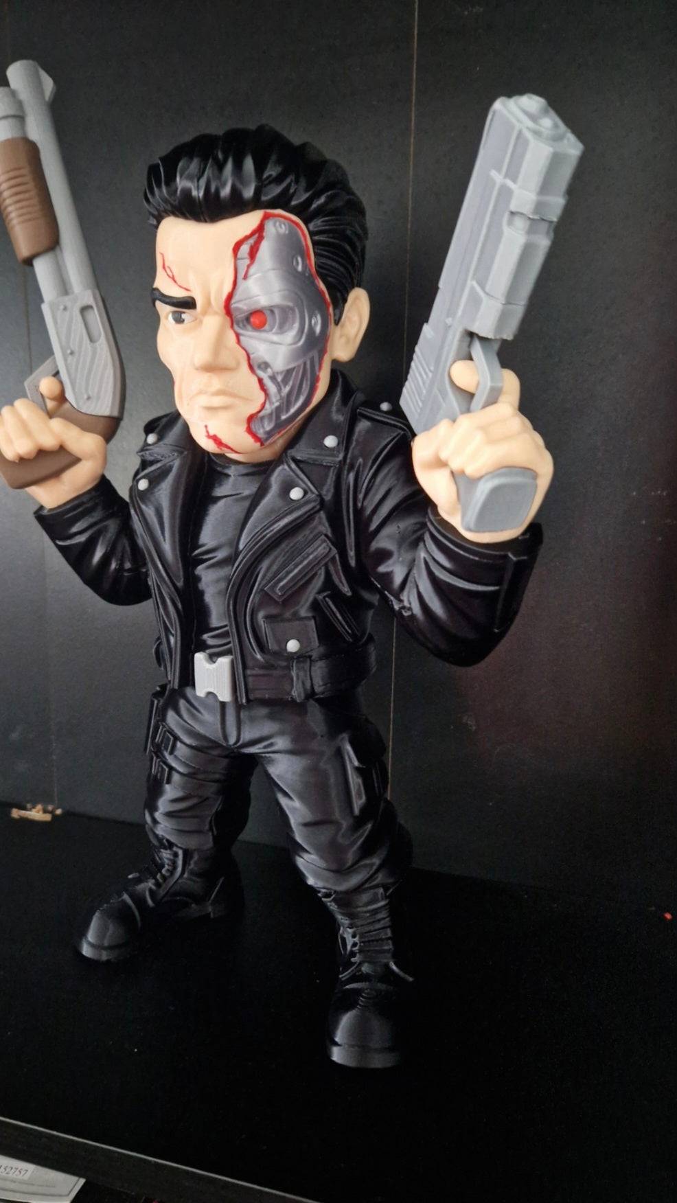 25-inch Terminator figure with detachable fake guns for collector display