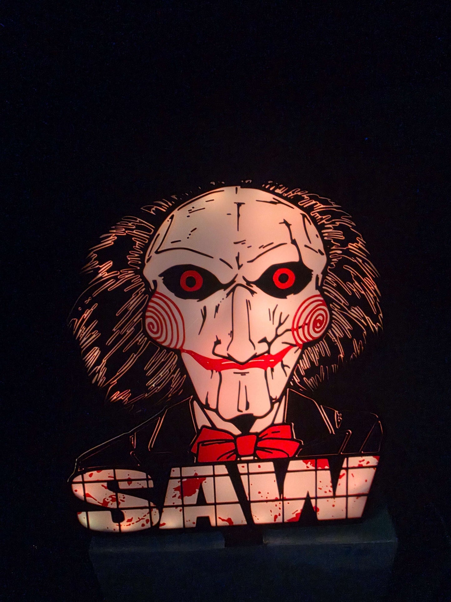 Large saw lightbox featuring ONN LED Billy the Puppet horror theme