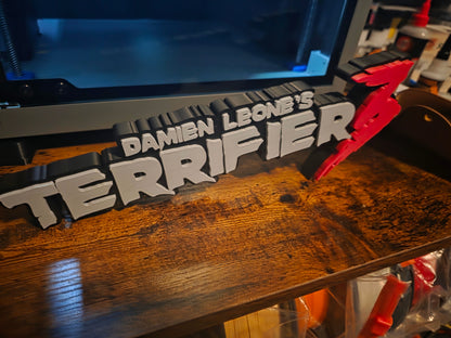 12-inch grey Terrifier 3 logo sign art featuring The Clown motif