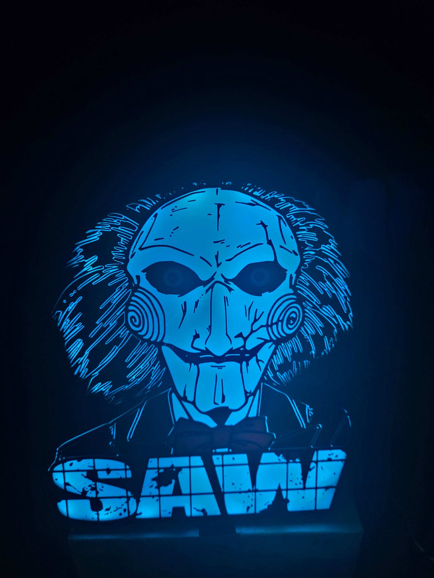Large saw lightbox featuring ONN LED Billy the Puppet from horror series