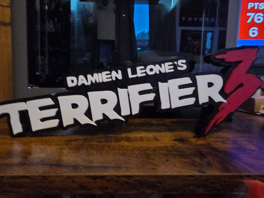 12-inch Terrifier logo art featuring Art the Clown horror prop for spooky decor and collectibles