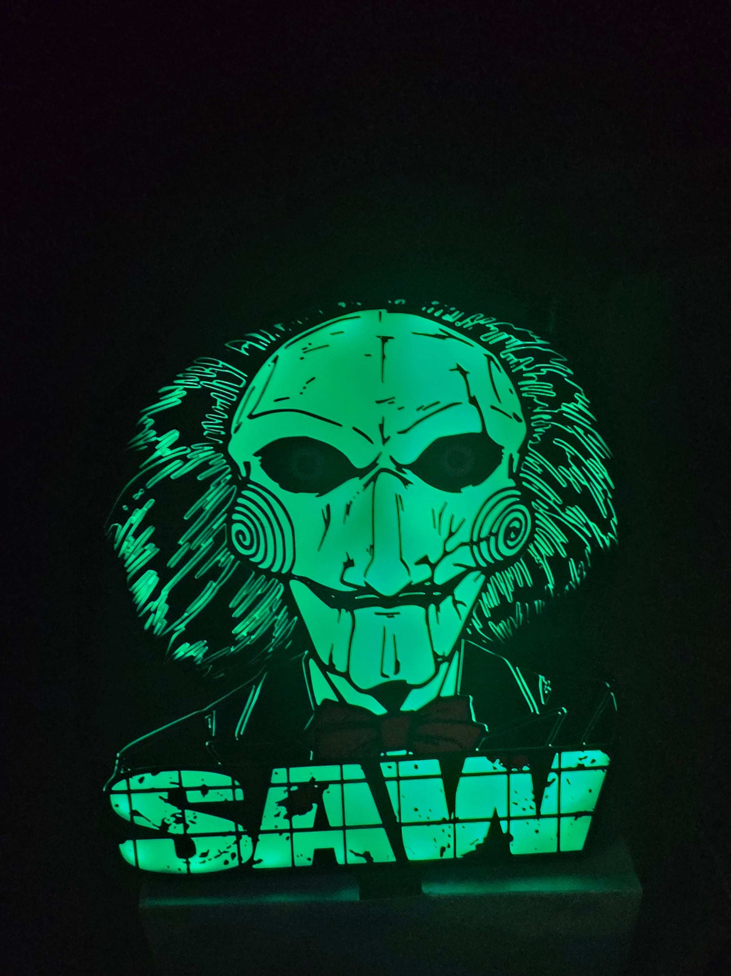 Large saw lightbox featuring LED Billy the Puppet from horror theme