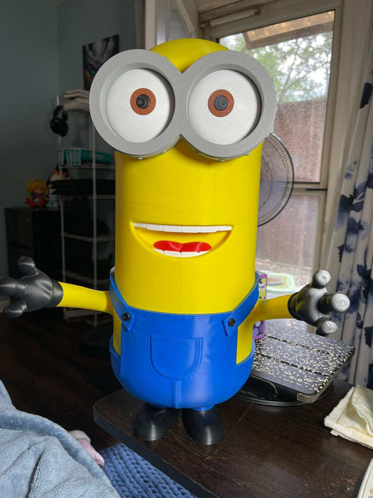 Kenny from Despicable Me 24-inch tall Minion figure standing upright on display shelf
