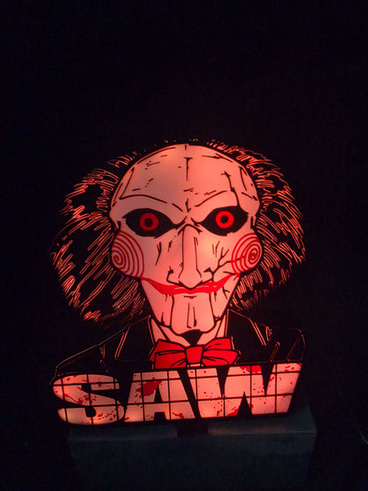 Large saw lightbox featuring Onn LED Billy the Puppet horror theme