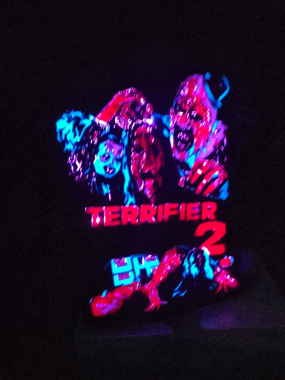 Terrifier 2 art the clown lightbox with red blue white and black colors
