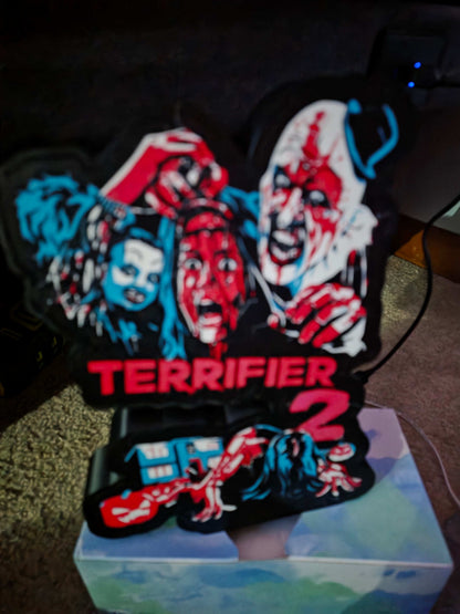 Terrifier 2 art of The Clown in red blue white black lightbox