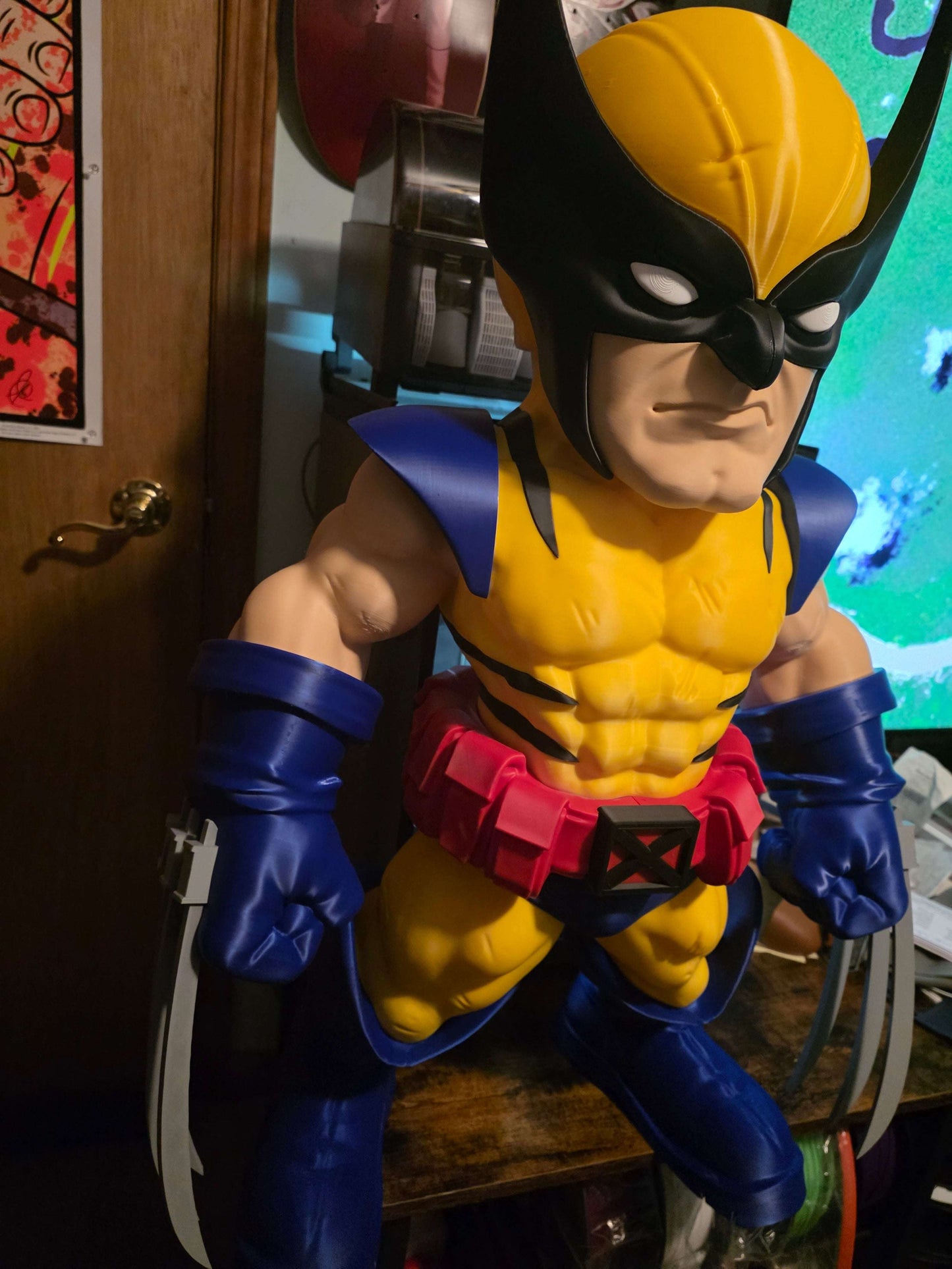 32-inch 1980s Wolverine collectible display piece with blue/red and black/brown suit variants