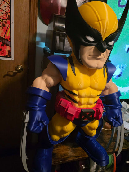 32-inch 1980s Wolverine collectible display piece with blue/red and black/brown suit variants