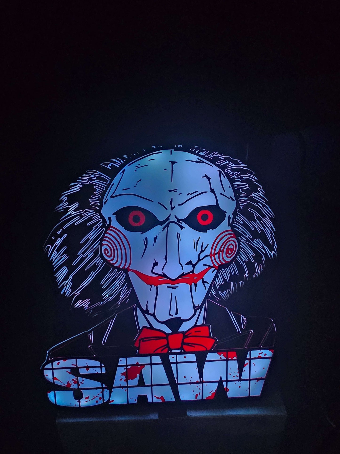 Large saw lightbox featuring ONN LED Billy the Puppet horror theme