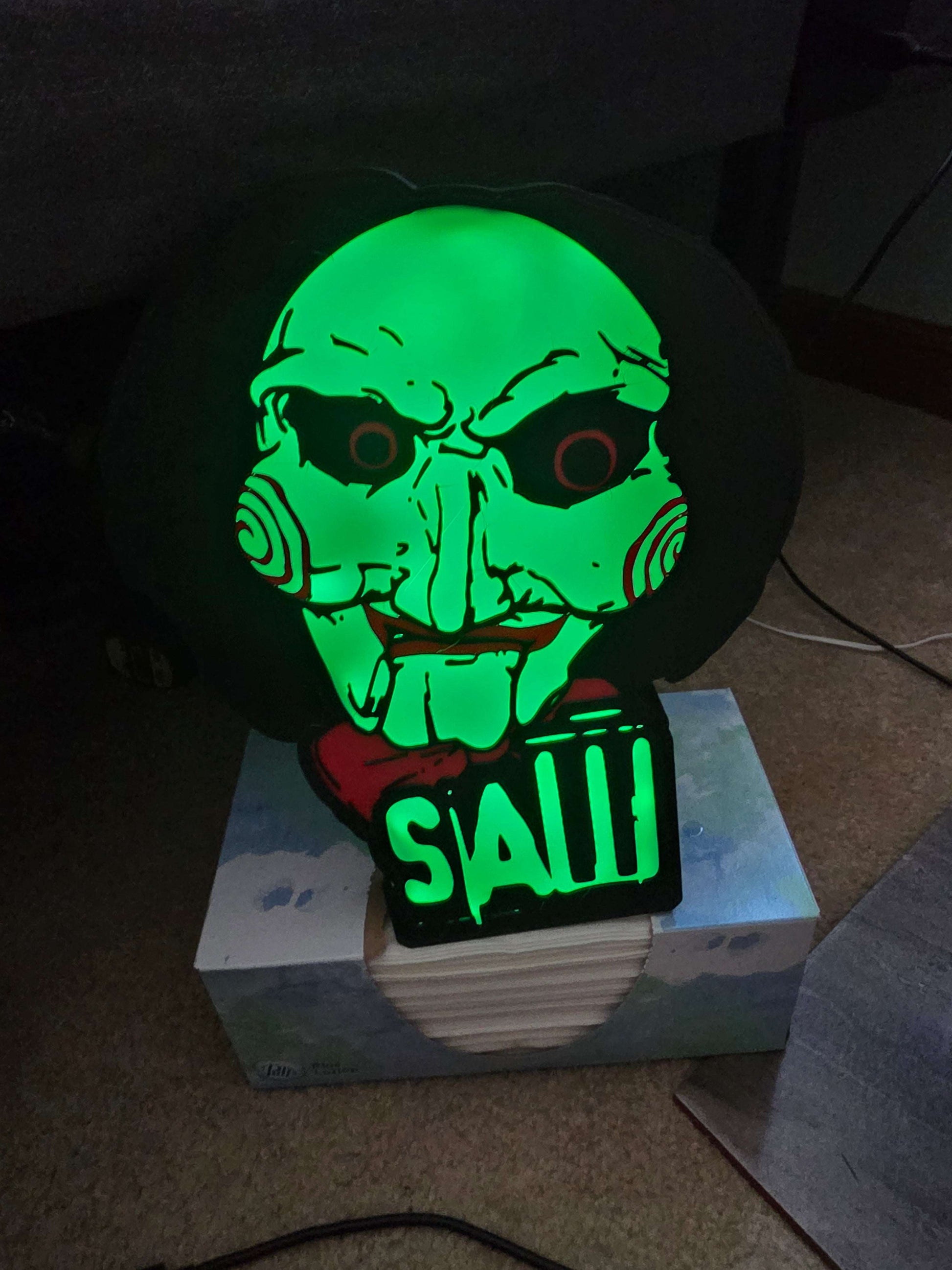 10-inch saw-shaped LED lightbox with horror icon and remote control illuminating wall decor