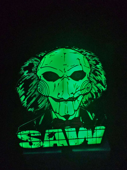 Large saw lightbox featuring ONN LED Billy the Puppet from horror-themed gore series