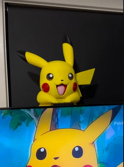 Pikachu screen buddy mounted on back of a full-size TV with hardware