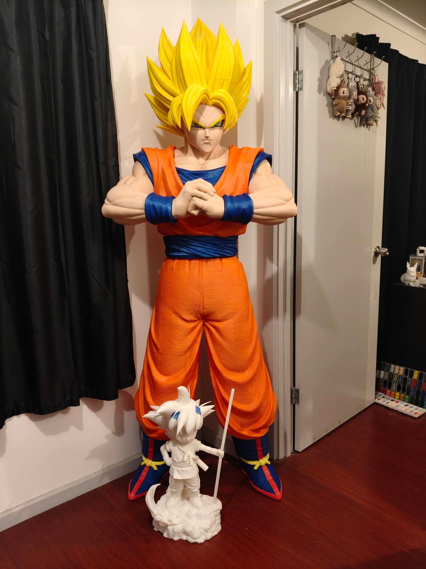 Large 1:1 scale life-size Dragon Ball Z Goku bust with blonde or black hair options, standing 5 ft 9 in tall