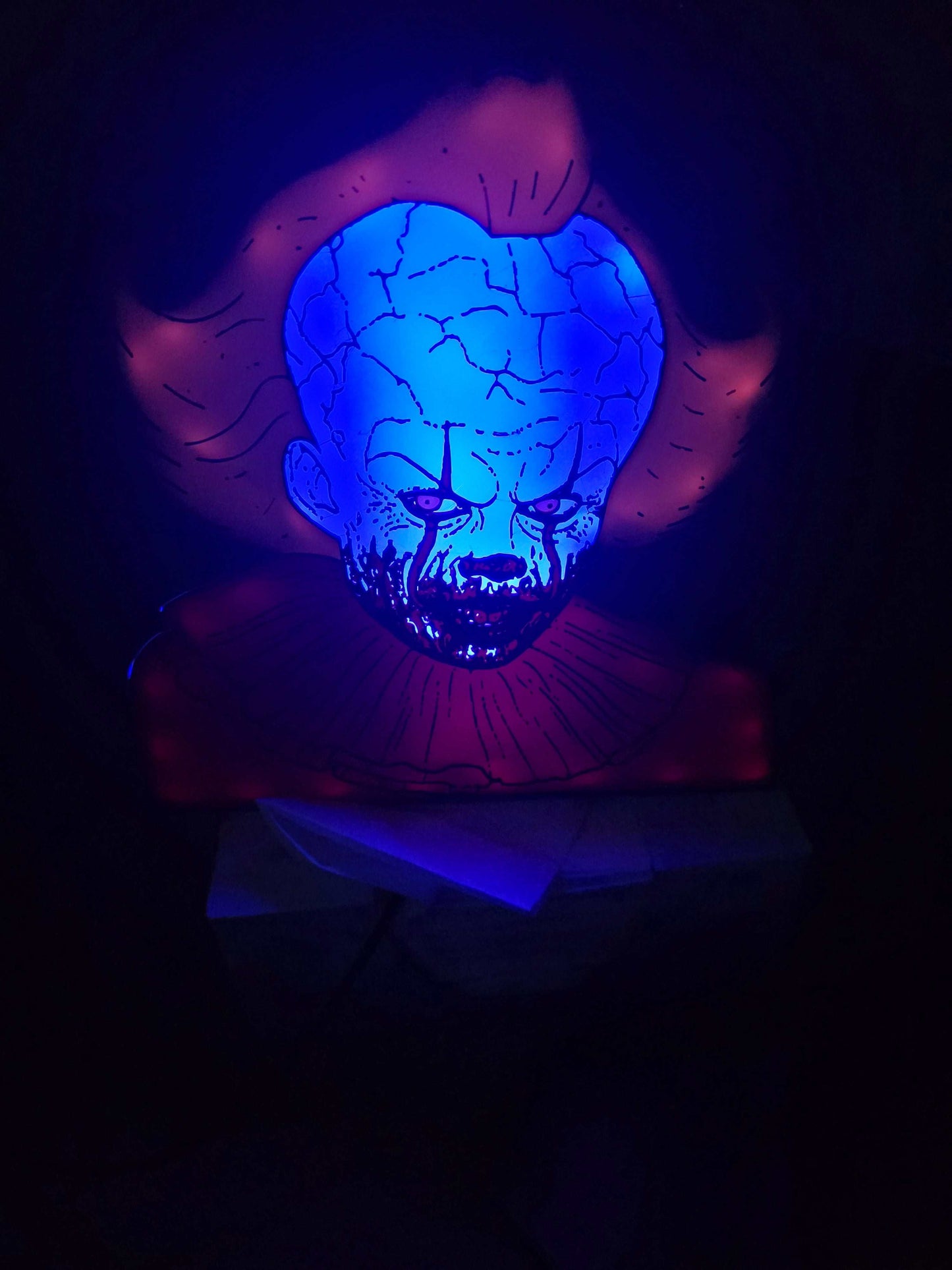 Pennywise 10" dancing clown lightbox glowing on shelf for horror decor