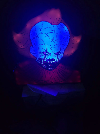Pennywise 10" dancing clown lightbox glowing on shelf for horror decor