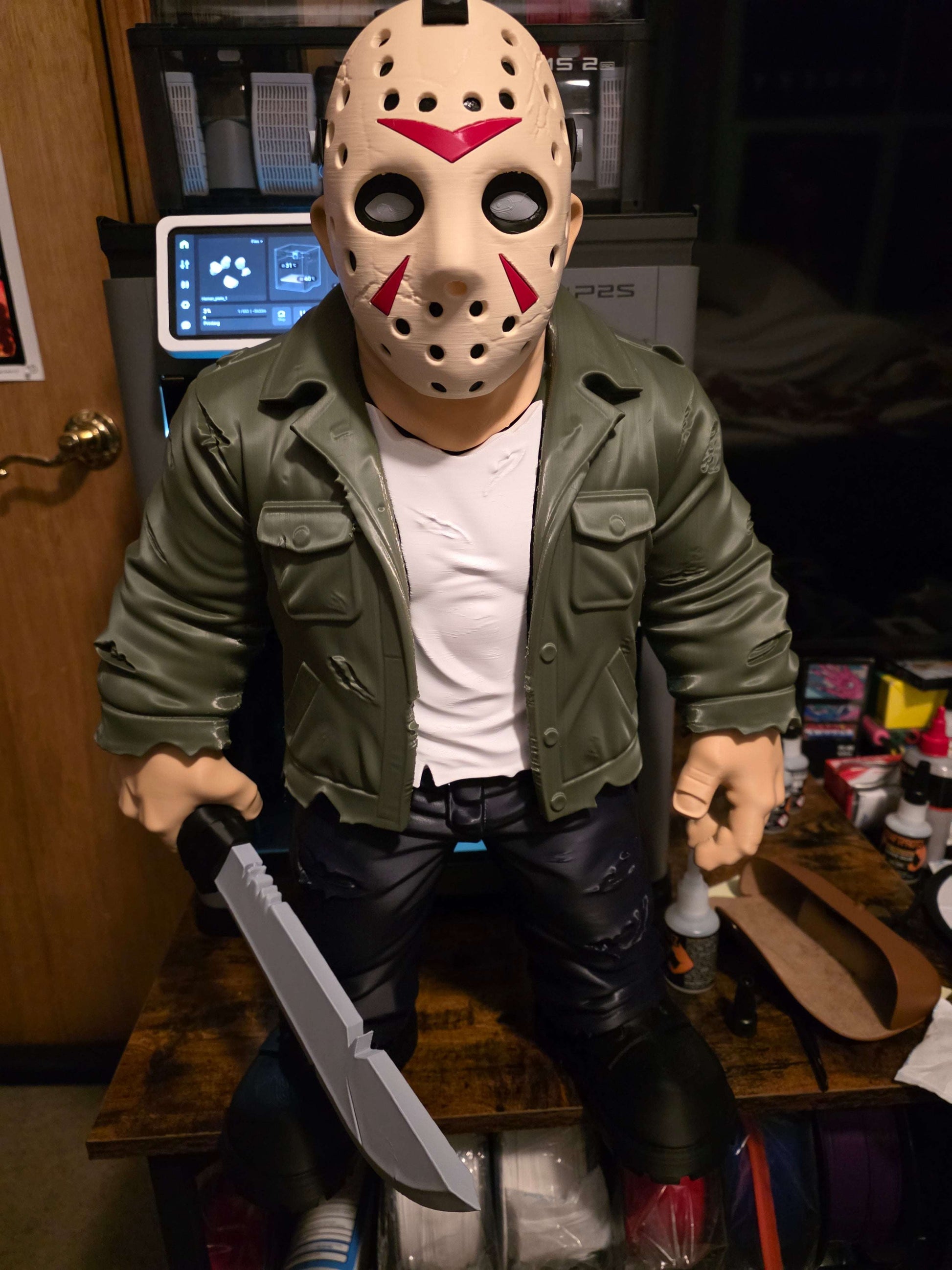 23" tall Jason Voorhees figure from Friday the 13th holding a sword measuring 15x14 inches